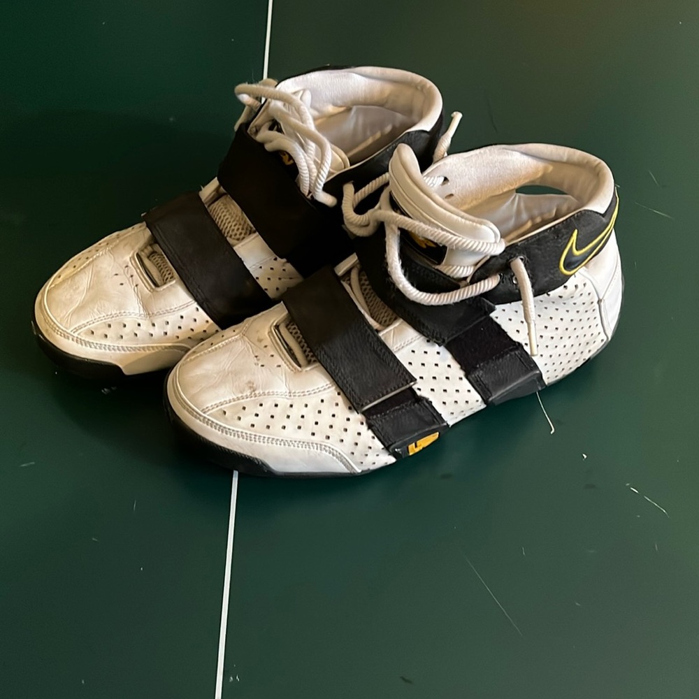 Nike White and Black Athletic Shoes with Yellow Accents